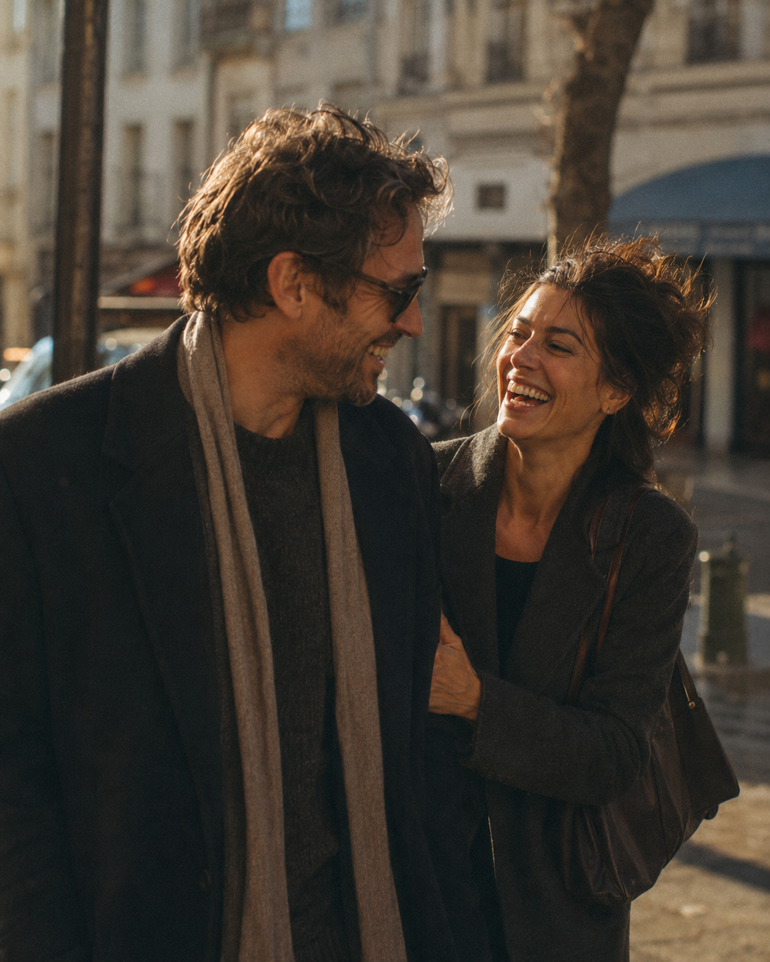 A couple walking freely on a sunlit street