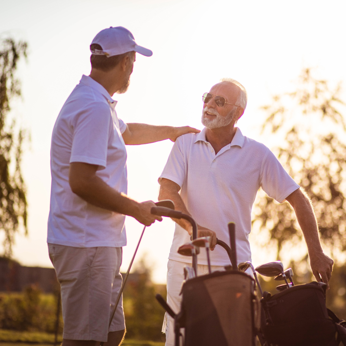 Two leaders sharing a relaxed moment on the golf course