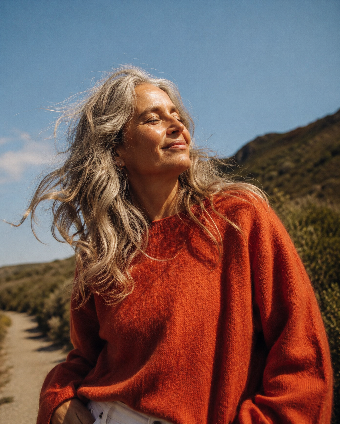 A woman walking outdoors in the sun, free and protected